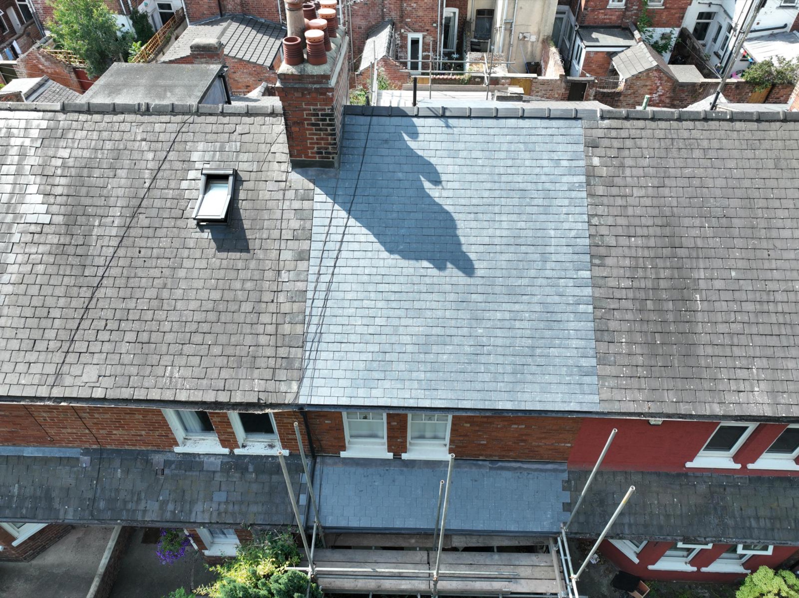 Front roof slope with new CUPRA natural slate and ridge tiles at Hambleton Terrace, York
