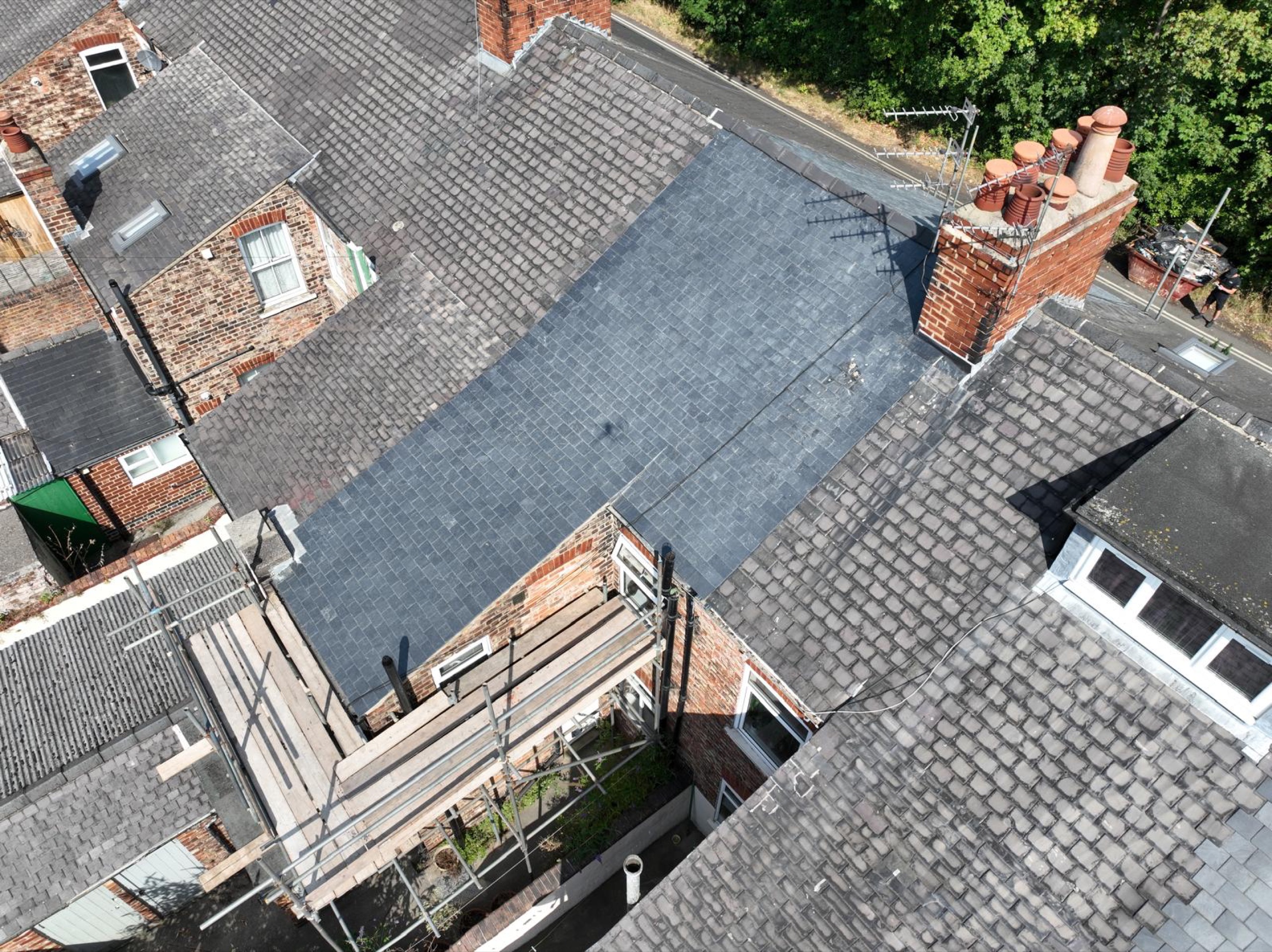 Completed CUPRA slate roof beside the chimney and adjoining roofs at Hambleton Terrace, York
